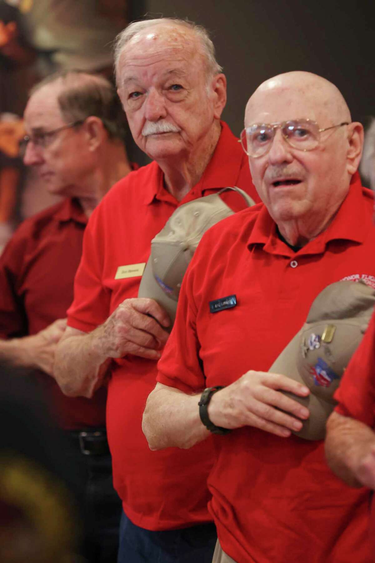 Navy veteran Don Stevens, 90, center, recites the Pledge of Allegiance at a monthly breakfast gathering with other veterans in New Braunfels last week. Stevens as a medical corpsman aboard a hospital ship anchored off the coast of Korea. With him are Air Force veterans Dennis Lehr, 69, left, and Richard Lavdar, 84, right.