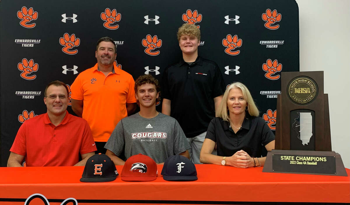 Edwardsville's Spencer Stearns, seated center, will play college baseball for SIUE next season. He is joined in the picture by his family and Edwardsville coach Tim Funkhouser.