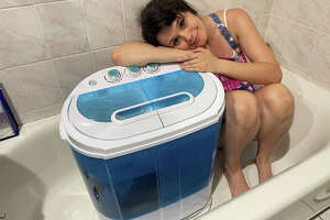 I am in love with this teeny portable washing machine