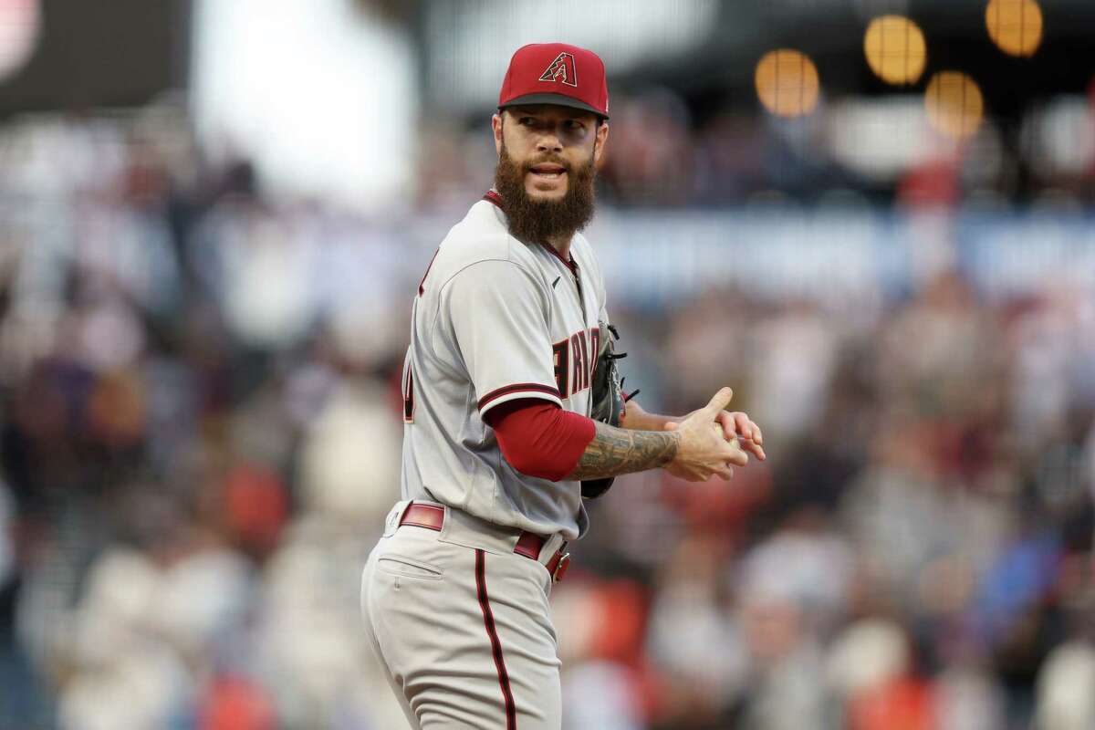 Dallas Keuchel of the Arizona Diamondbacks reacts after giving up a home run to Thairo Estrada of the San Francisco Giants in the third inning at Oracle Park on July 12, 2022 in San Francisco, California.