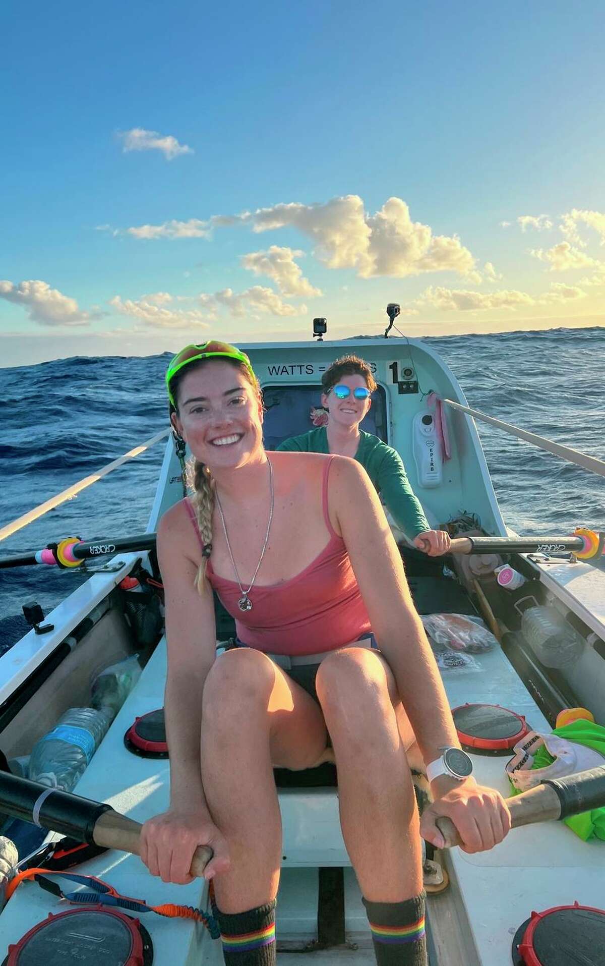 Rowers Brooke Downes (front) and Libby Costello take their turn at the oars during their Pacific voyage from San Francisco to Hawaii.