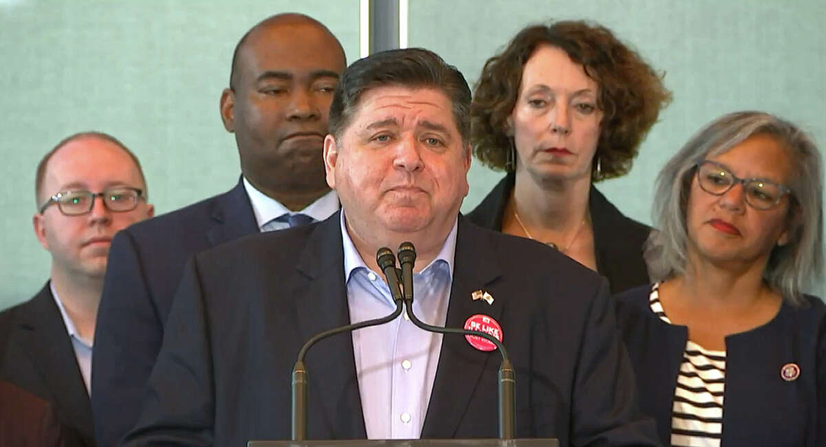 Gov. J.B. Pritzker speaks at a news conference in Chicago with members of the Democratic National Committee in an attempt to land the 2024 convention for Chicago. At the right is U.S. Rep Robin Kelly, who chairs the state’s Democratic Party.