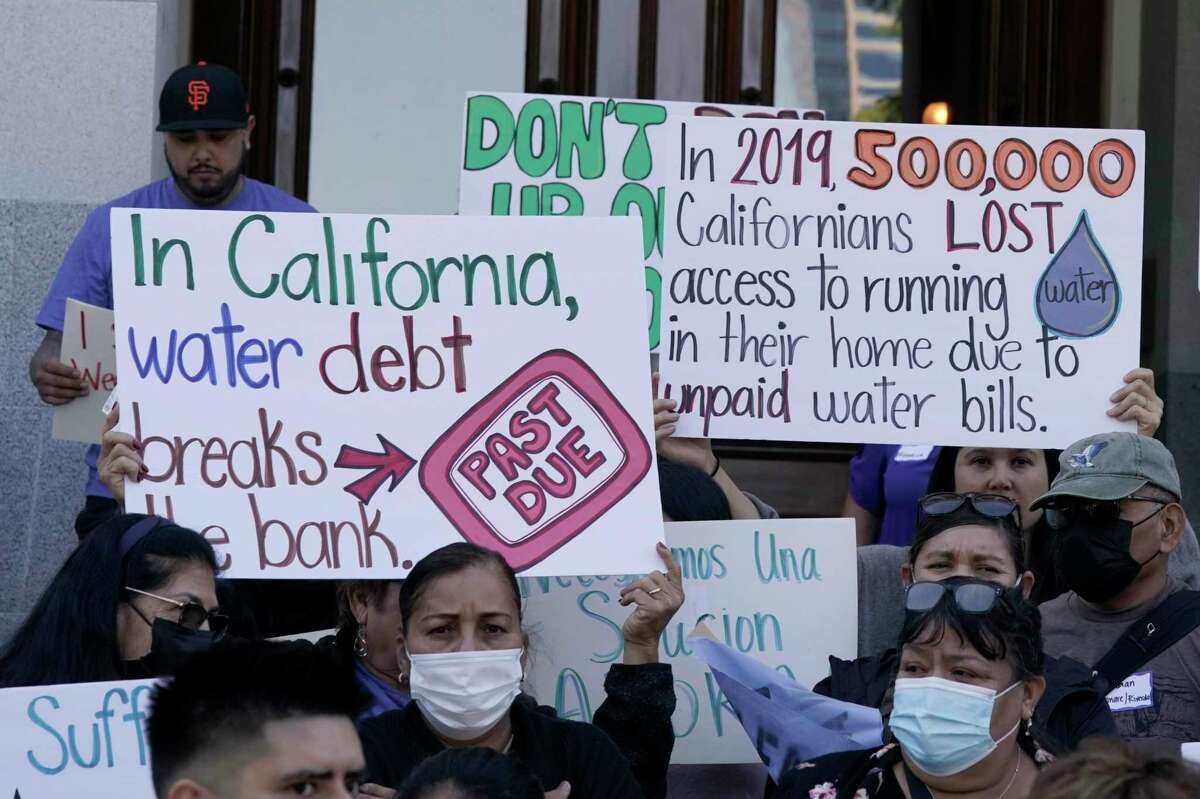 Demonstrators protest for safe drinking water at the Capitol in Sacramento this spring. A state auditor’s report says that nearly 1 million Californians lack clean drinking water and the state water board is too slow in getting the money and assistance out to help them.