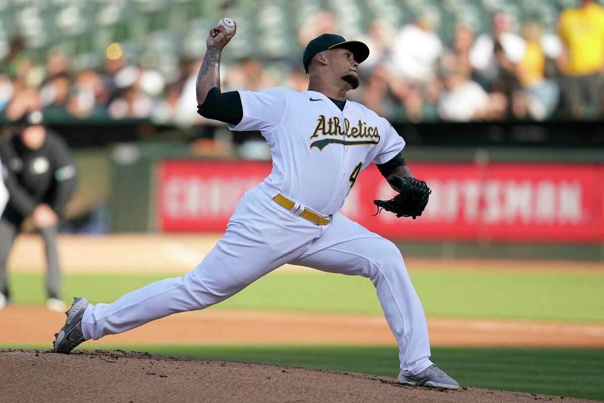 Oakland Athletics' Frankie Montas pitches against the Houston Astros during the first inning of a baseball game in Oakland, Calif., Tuesday, July 26, 2022. (AP Photo/Jeff Chiu)