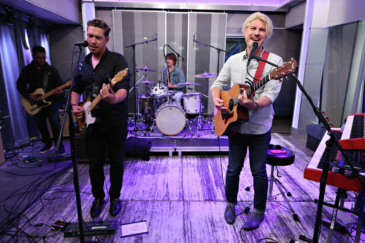 Isaac Hanson, Taylor Hanson and Zac Hanson (back) of Hanson perform at the SiriusXM Studios on May 20 in New York City. (Photo by Cindy Ord/Getty Images)