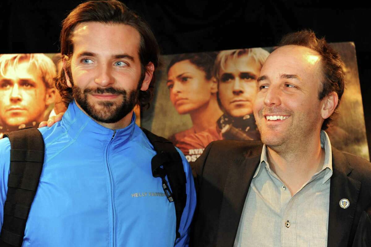 Bradley Cooper, left, and director Derek Cianfrance, right, at the 2013 premiere of  "The Place Beyond the Pines" at Bow-Tie Cinemas Movieland 6 in Schenectady. Did working on this film inspire Cooper and co-star Ryan Gosling (on movie poster in background) to make their own directorial debuts, with 2018's "A Star Is Born" and 2014's "Lost River," respectively?