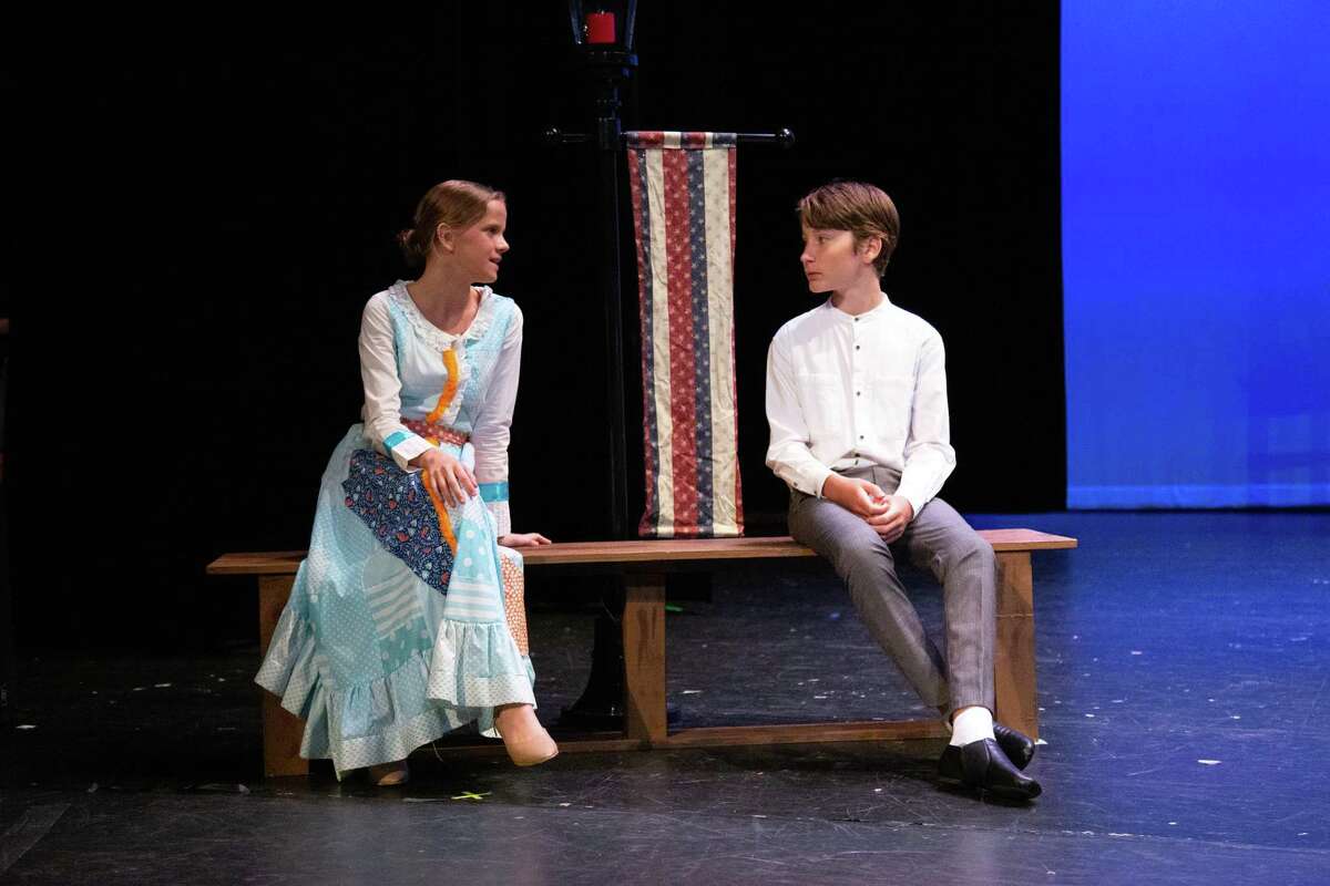 Charlotte Lane and Thomas Wipple share a moment onstage during a rehearsal of ‘The Music Man.’