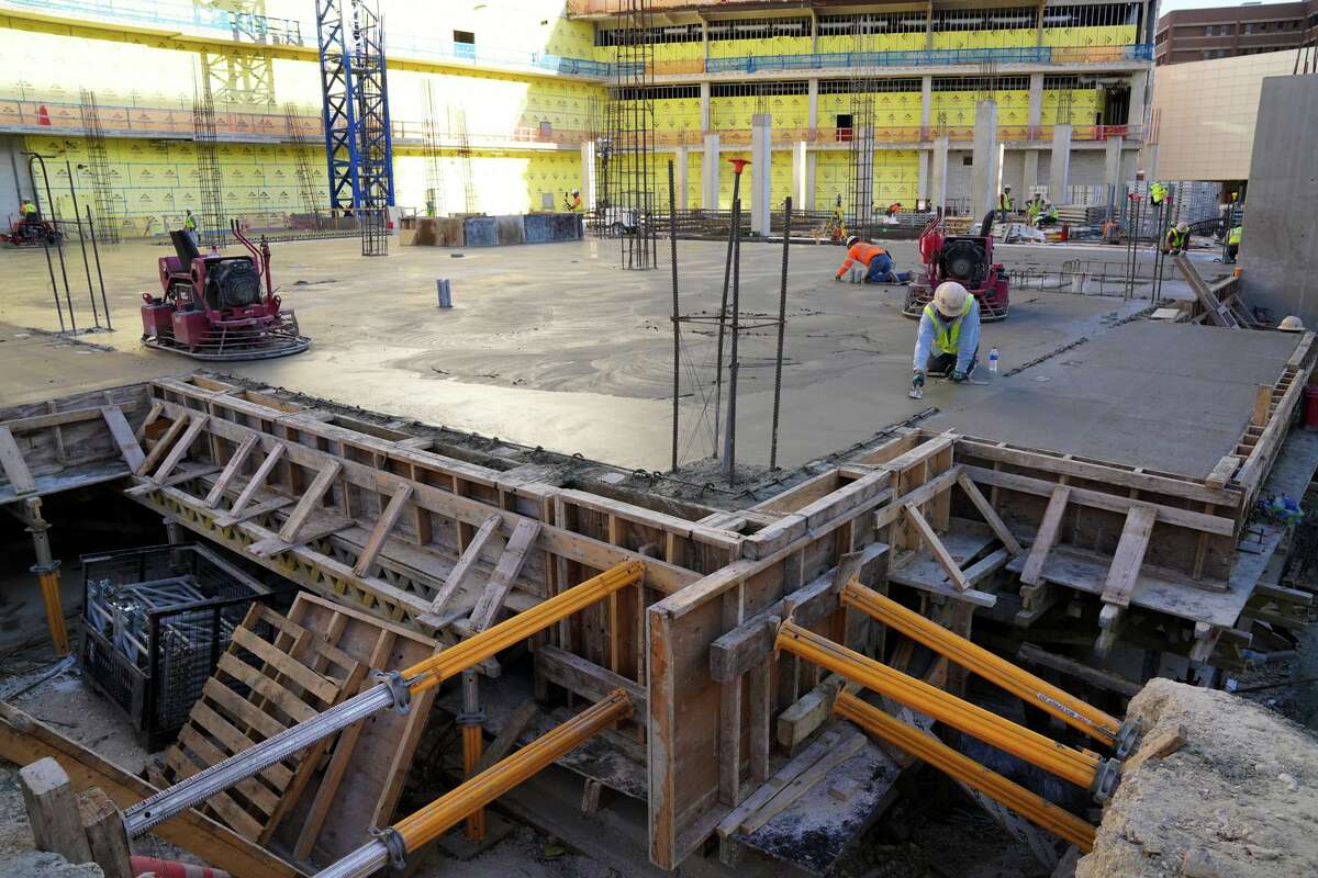Concrete workers finish a floor during construction of the University Health Woman’s and Children’s Hospital, which is slated to open in mid-2023. The 12-story, 300-bed hospital for women, babies and children also features a 900-space parking garage. And a pediatric pharmacy will be added after University Health’s board of managers approved budget adjustments to accommodate the new project.