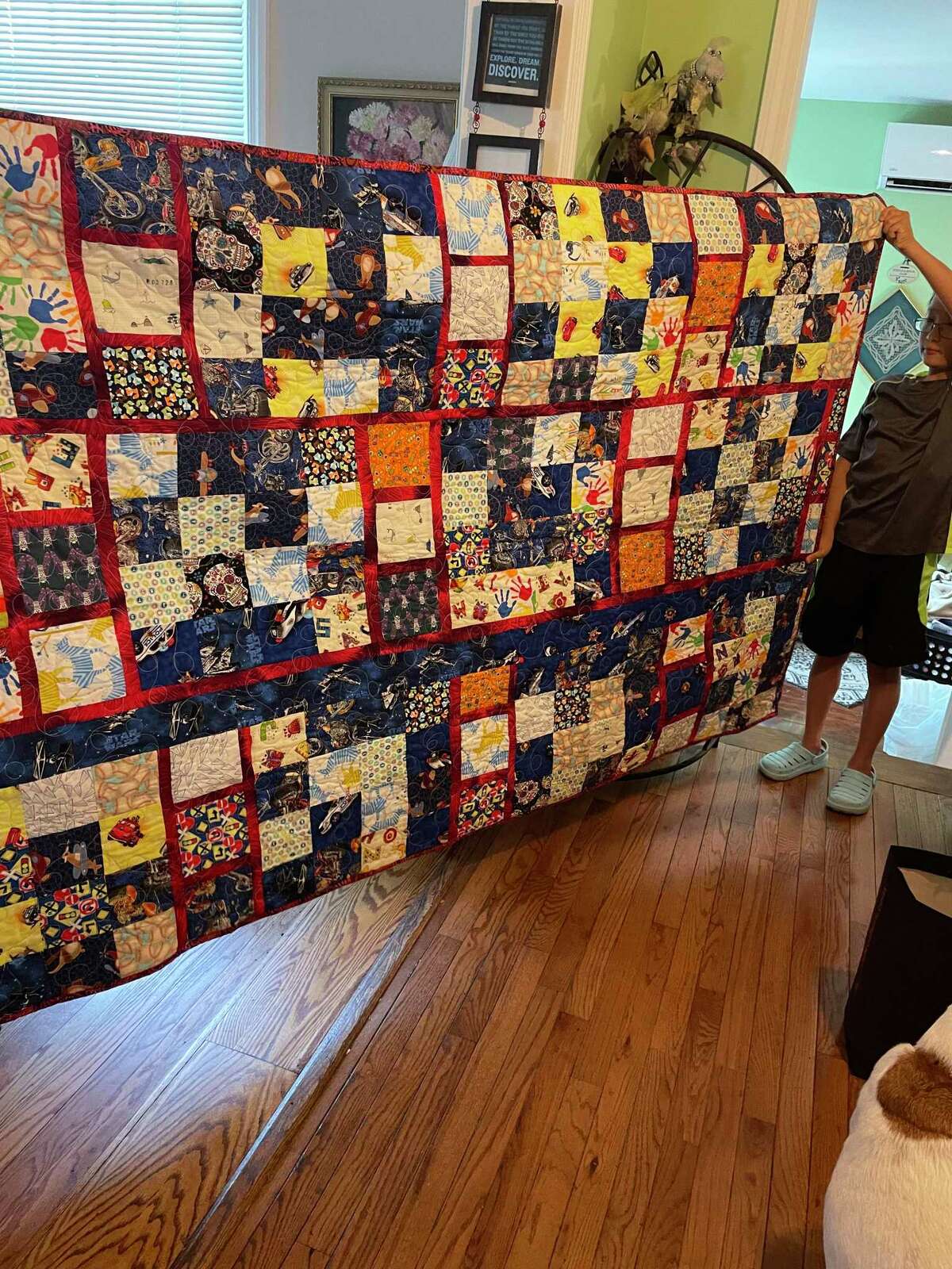 Steven Gaynes presented quilts he and his wife made to his grandchildren.
