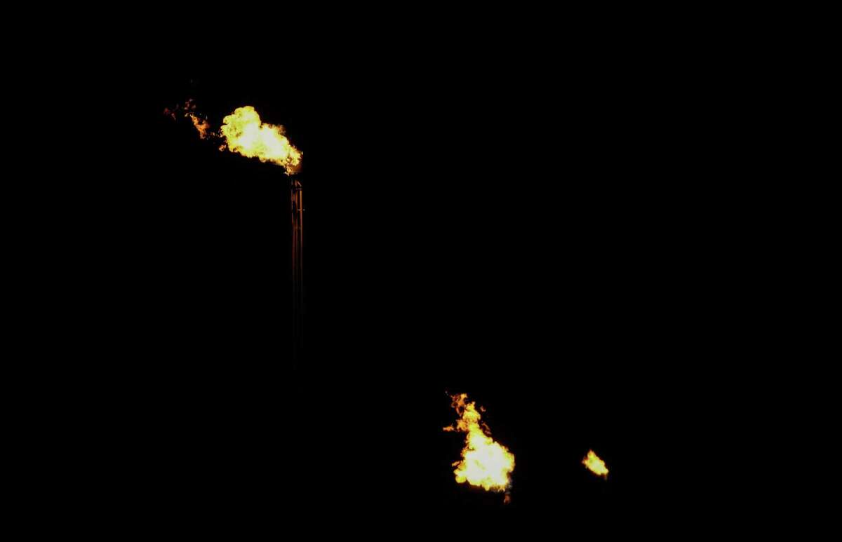 Three flares burn Thursday, July 7, 2022, near Odessa.