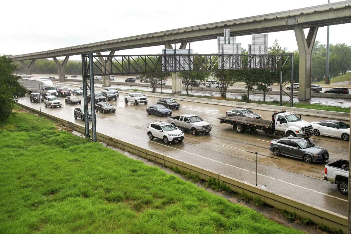Traffic moves along Interstate 10 under the Houston Avenue bridge on on a wet day,  Wednesday, July 27, 2022 in Houston. Rain is expected for Astros' fans commute on Friday.