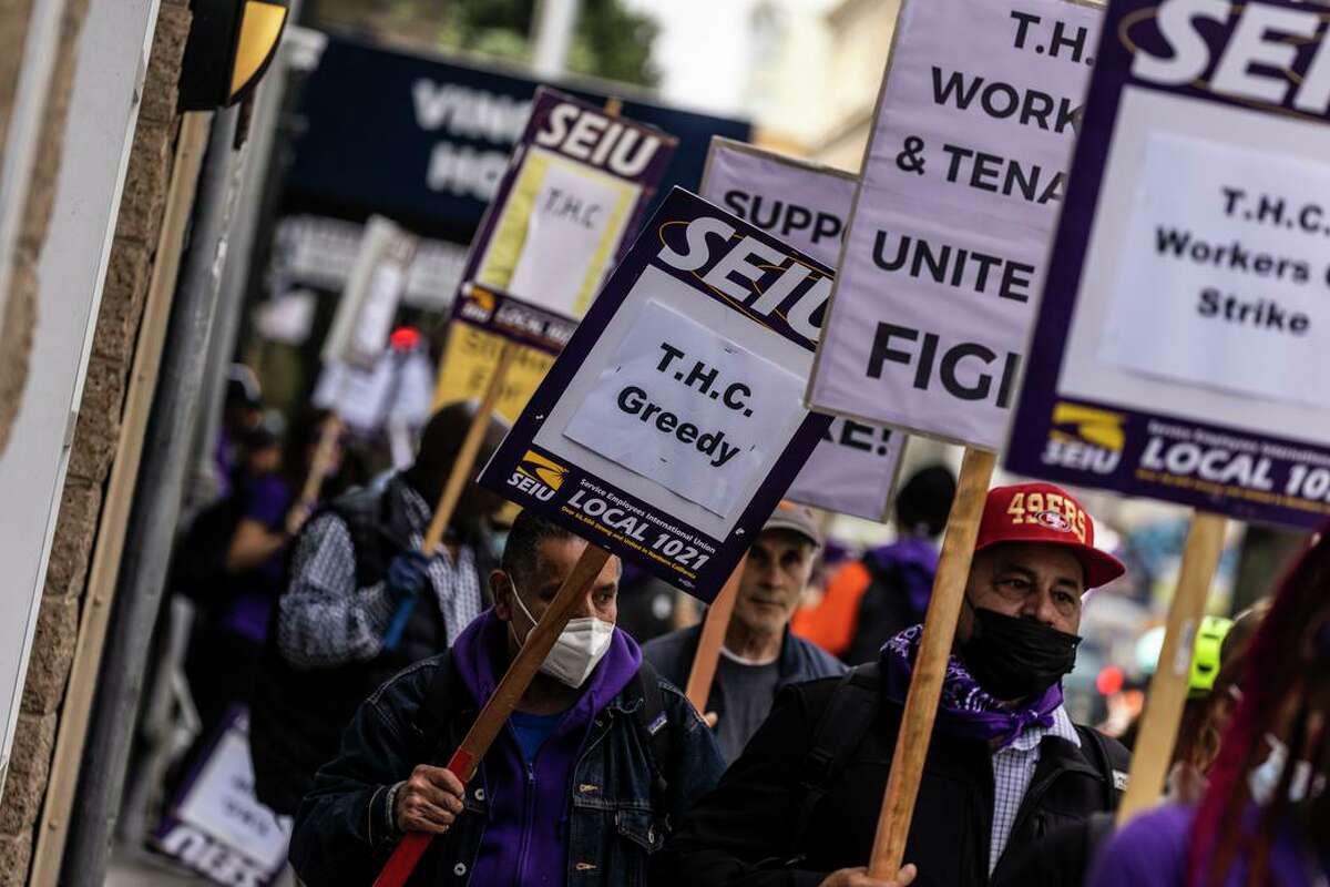 Protesters picket Turk Street during a strike by Tenderloin Housing Clinic workers in the Tenderloin neighborhood of San Francisco, Calif., Wednesday, July 27, 2022.