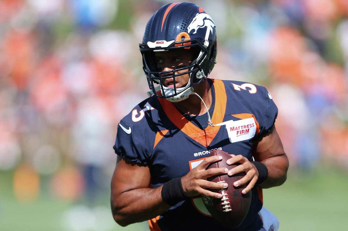 Quarterback Russell Wilson practices with the Broncos on Wednesday. Wilson, who won a Super Bowl title with the Seahawks, says Denver has the stuff to win its first title since Peyton Manning was the quarter- back.
