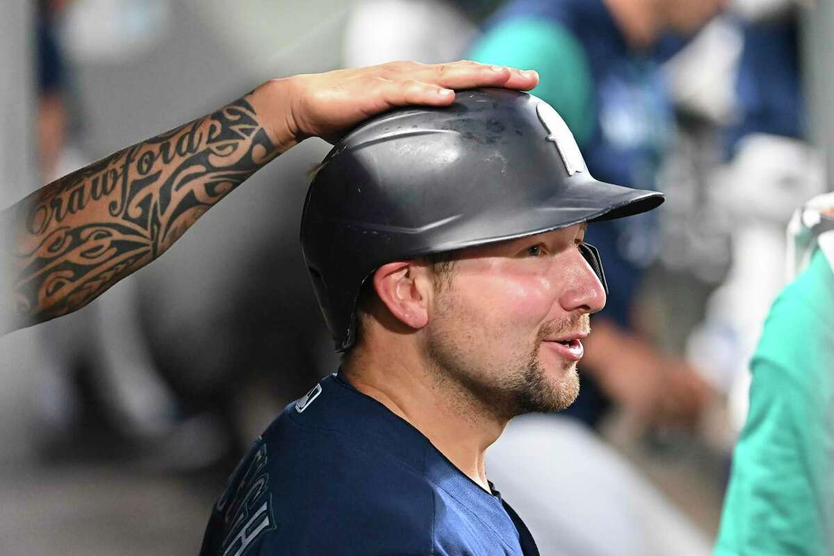Cal Raleigh deserves a hand, like this one from tatted Mariners shortstop J.P. Crawford, for leading all major league catchers in home runs (13) and RBIs (36) since May 15.