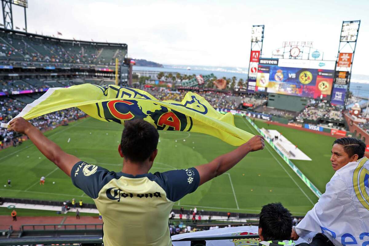 Club America fan Antonio Macias waves his team’s flag before their Soccer Champions Tour match against Real Madrid at Oracle Park in San Francisco, Calif., on Tuesday, July 26, 2022.