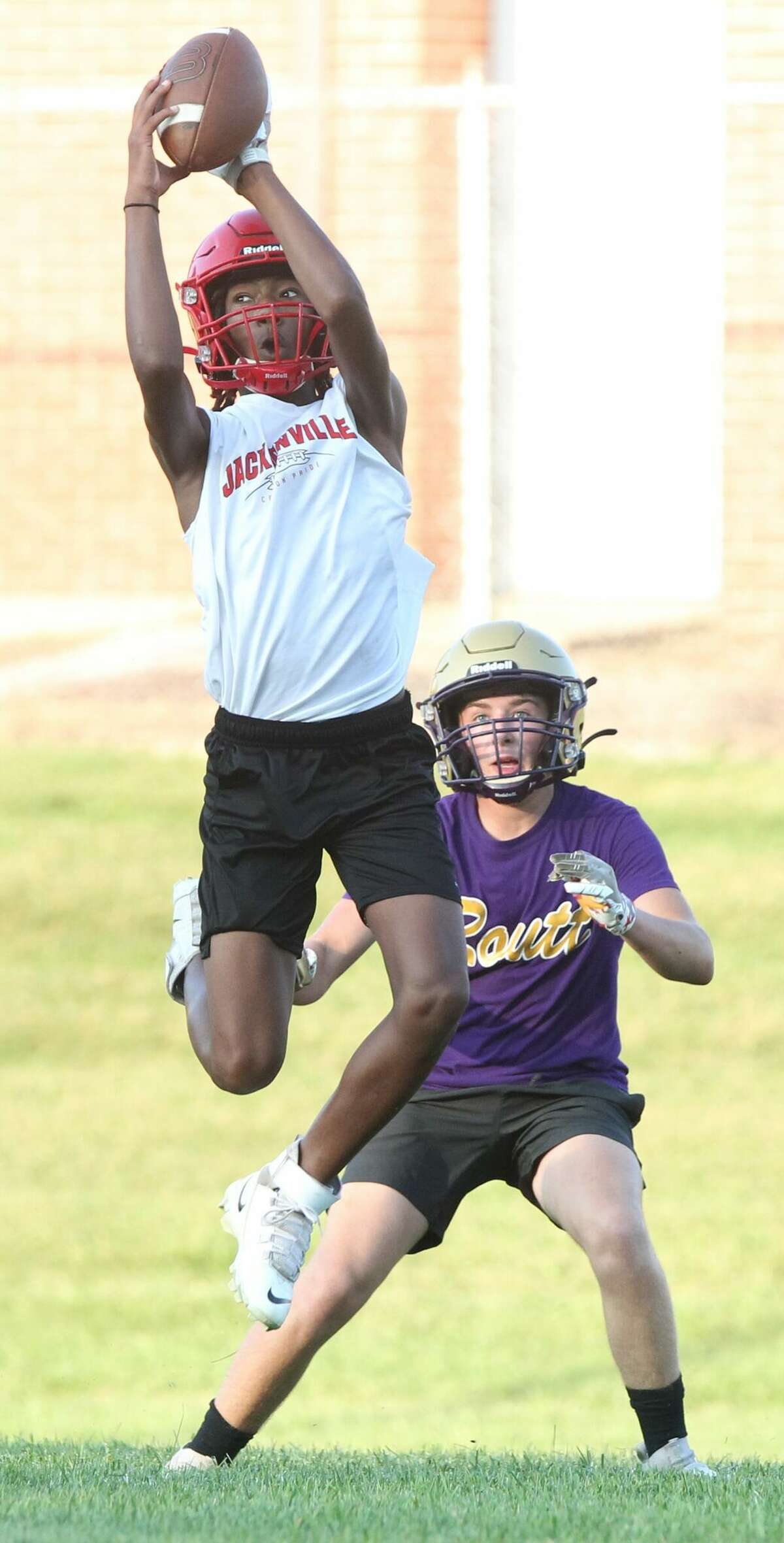 A Jacksonville receiver jumps high for a catch during a 7-on-7 with Routt at the JHS practice field on Wednesday night. More photos later.