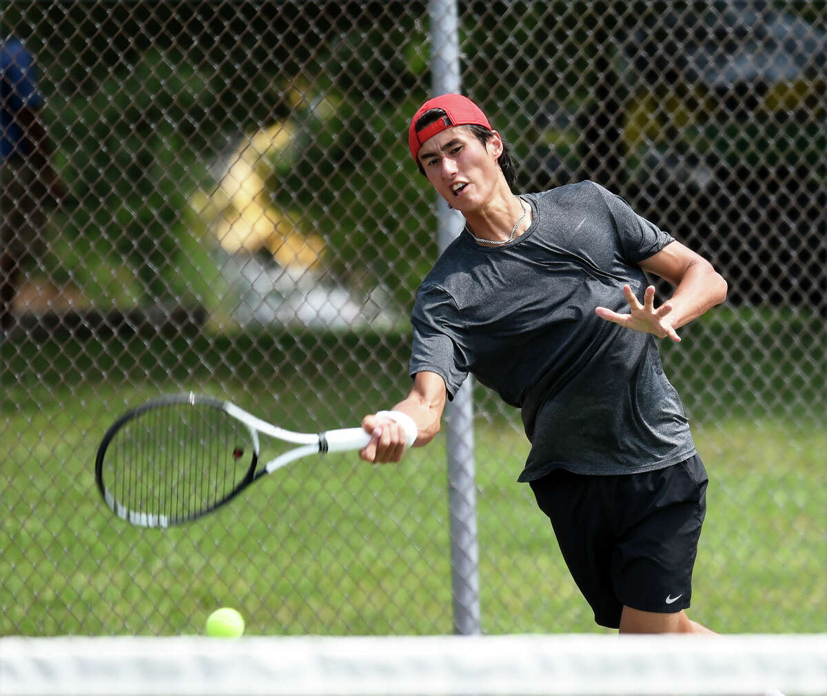James Kent Trotter hits a shot during the USTA Edwardsville Futures tennis tournament on Thursday in Edwardsville.