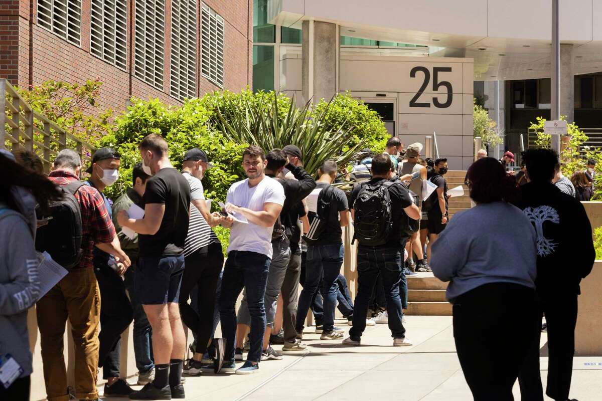 People stand in long lines to receive the monkeypox vaccine at San Francisco General Hospital this month.