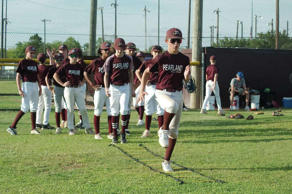 Jake Zurek leads the rest of the Pearland Little League All Stars during a warm-up drill before practice on July 26. For the first time since 2016, Pearland will participate in the Southwestern Region Little League championship tournament in Waco.
