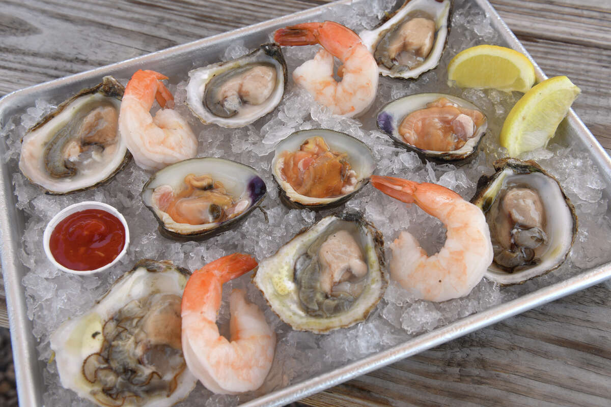 A tray of Copps Island oysters, Bloom Brothers little neck clams and shrimp cocktail served on ice at the Copps Island Oyster Shack, a new food truck and dining area at Brown's Marina in Stratford.