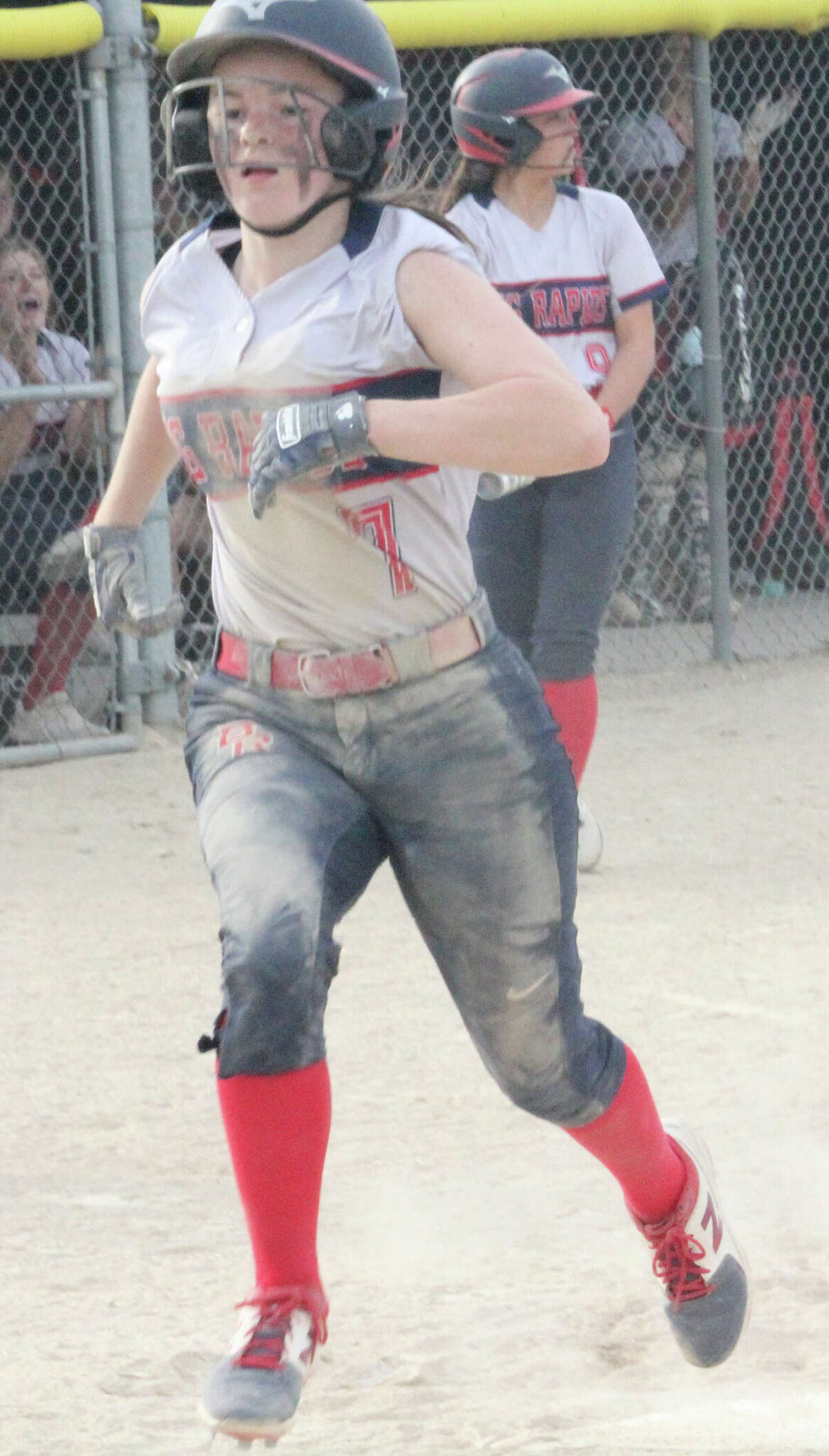 Pharis Carroll crosses the plate for Big Rapids during a game this past season.