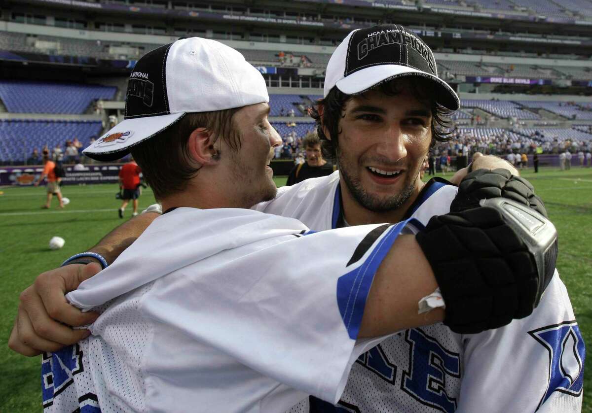 Duke's Brandon Allen, left, hugs teammate CJ Costabile after Duke defeated Norte Dame 6-5 in overtime to win the NCAA men's lacrosse tournament championship game Monday, May 31, 2010, in Baltimore. (AP Photo/Rob Carr)