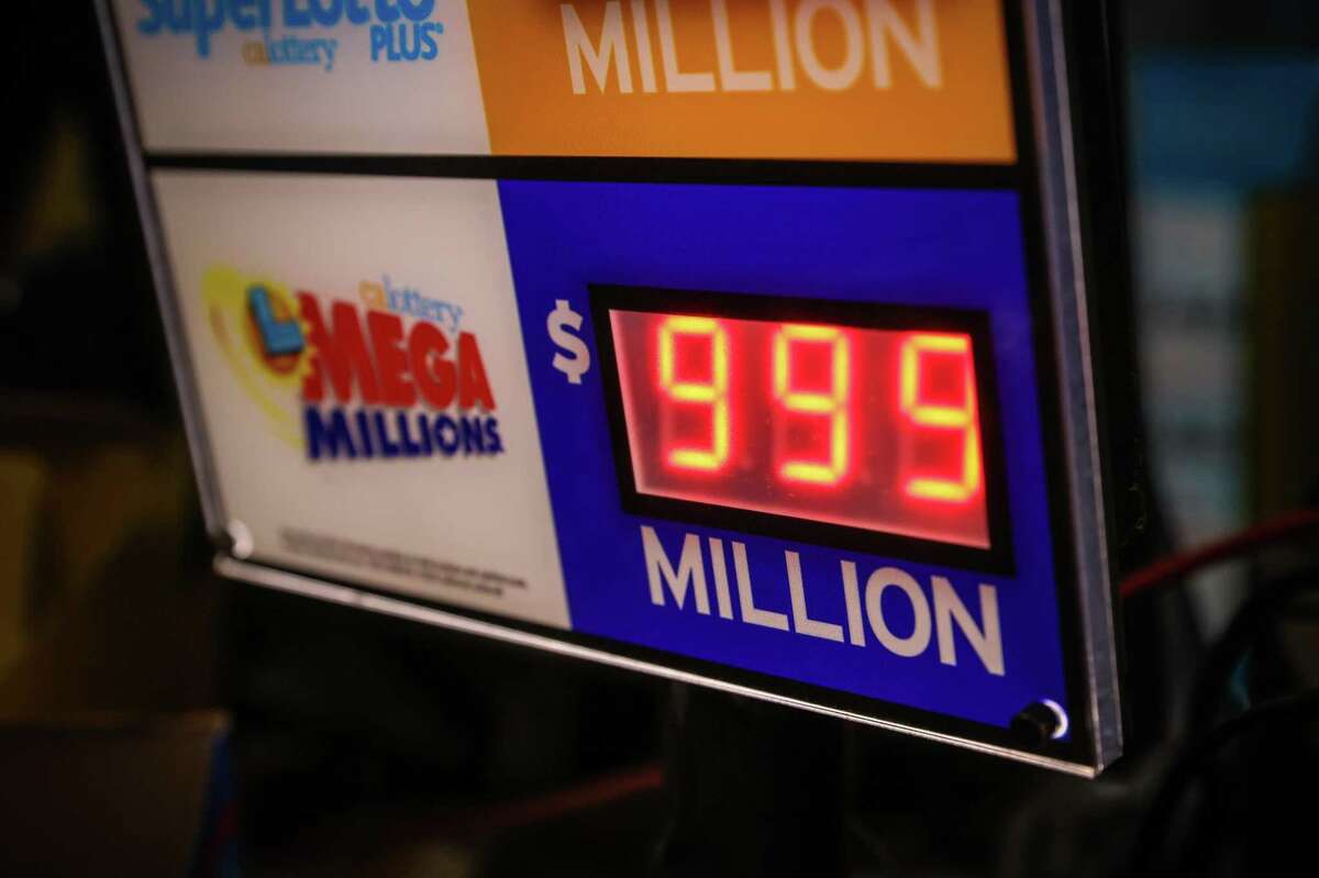 A sign displaying the Mega Millions amount at a billion dollars is seen at W&K Market in San Francisco, Calif., on Wednesday, July 27, 2022.