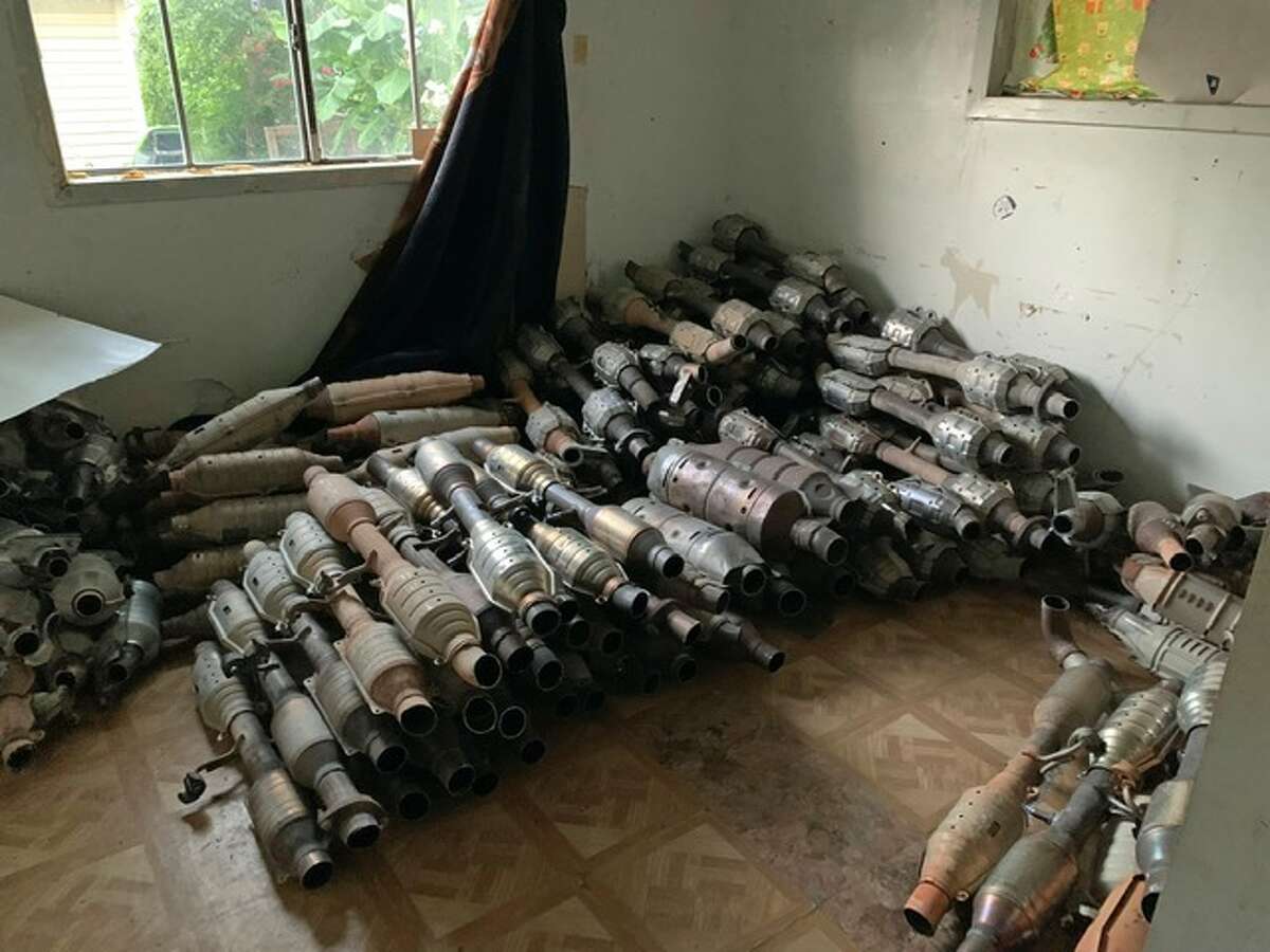 A pile of catalytic converters were found inside a Houston home raided by federal, state and local authorities on Thursday, July 28, 2022.