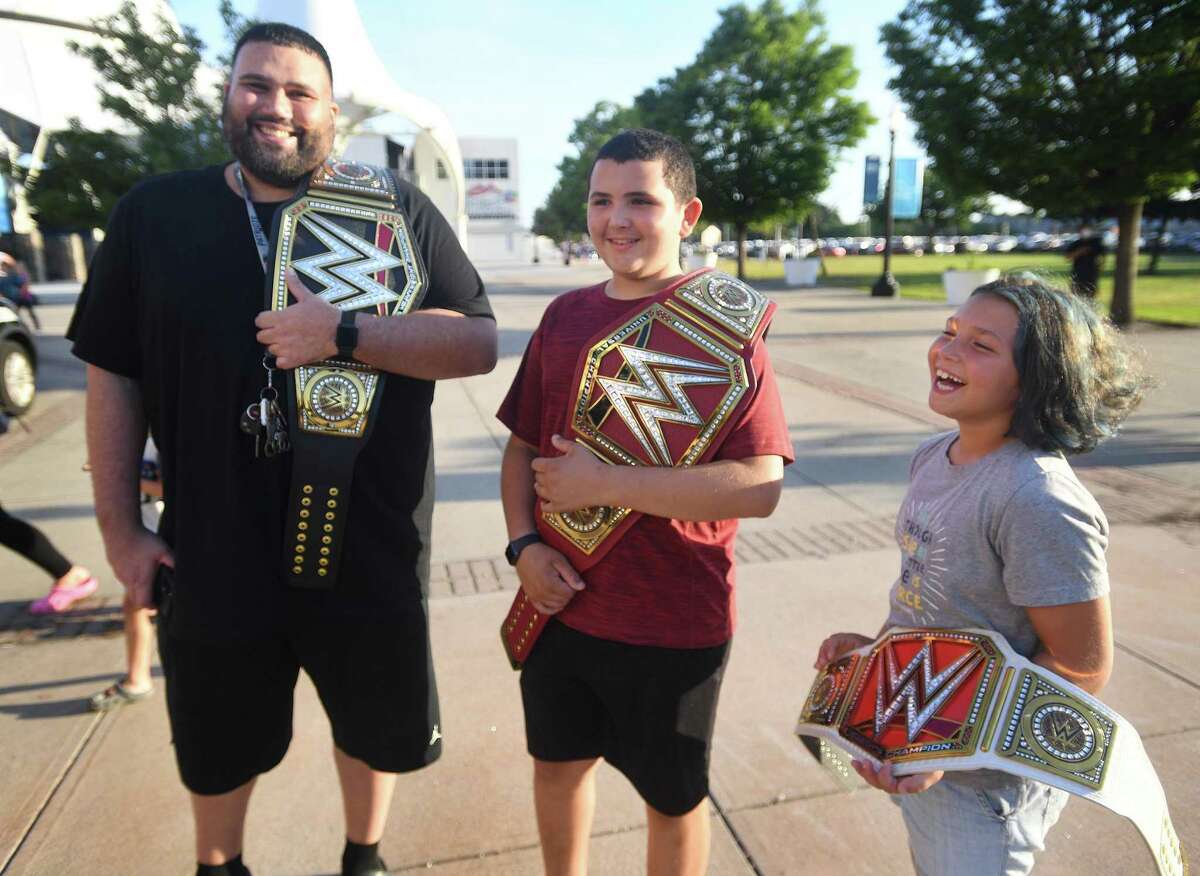 From left, Gabriel Diaz, of Bridgeport, accompanies his nephew, Robby Diaz, 13, and niece, Maddy Diaz, 9, both of Trumbull, to WWE’s “Saturday Night’s Main Event,” at Total Mortgage Arena in Bridgeport, Conn., on Saturday, July 23, 2022.
