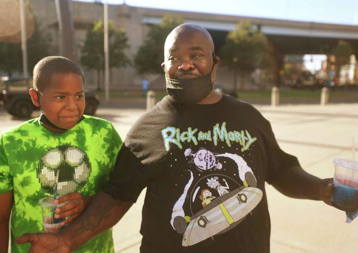 Kenny Coleman, right, and his nephew Celso Norales, 11, both of Bridgeport, attend WWE’s “Saturday Night’s Main Event,” at Total Mortgage Arena in Bridgeport, Conn., on Saturday, July 23, 2022.
