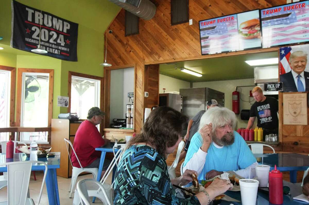 Margie Johnson, left, and Hub Gambel have lunch at Trump Burger Thursday, July 28, 2022 in Bellville. Both expressed support for former U.S. President Donald Trump. Gambel, now retired, says the administration's crackdown on undocumented immigrants led to a pay raise at his old construction company.