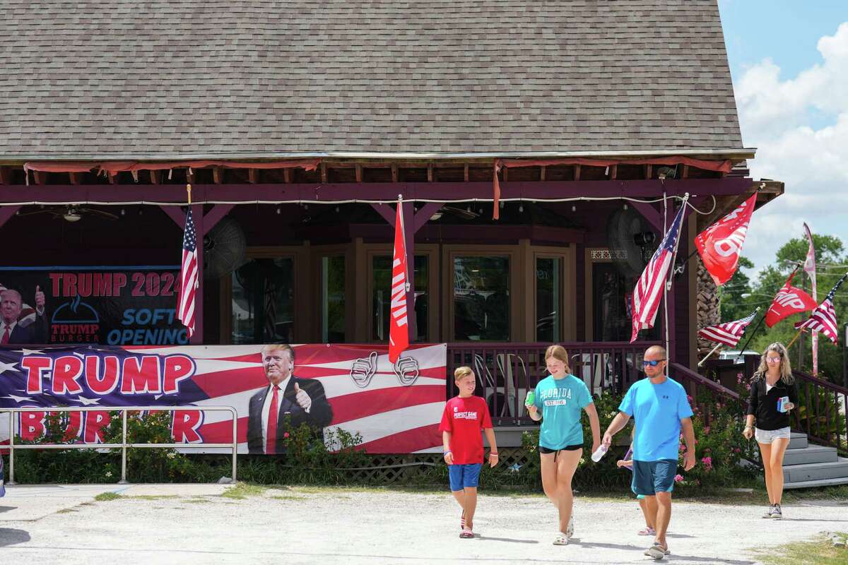 Customers are seen leaving Trump Burger after having lunch at the restaurant Thursday, July 28, 2022 in Bellville, Texas.