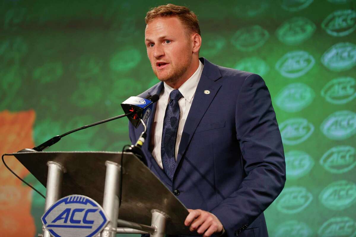 Miami quarterback Tyler Van Dyke answers a question at the NCAA college football Atlantic Coast Conference Media Days in Charlotte, N.C., Thursday, July 21, 2022. (AP Photo/Nell Redmond)