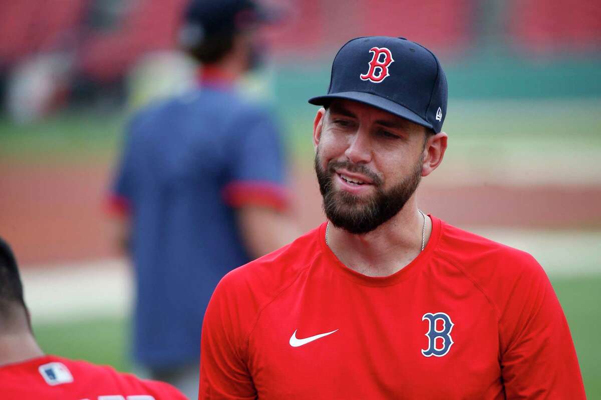 Boston Red Sox's Matt Barnes talks with a teammate during baseball practice at Fenway Park in Boston, Friday, July 3, 2020. (AP Photo/Michael Dwyer)