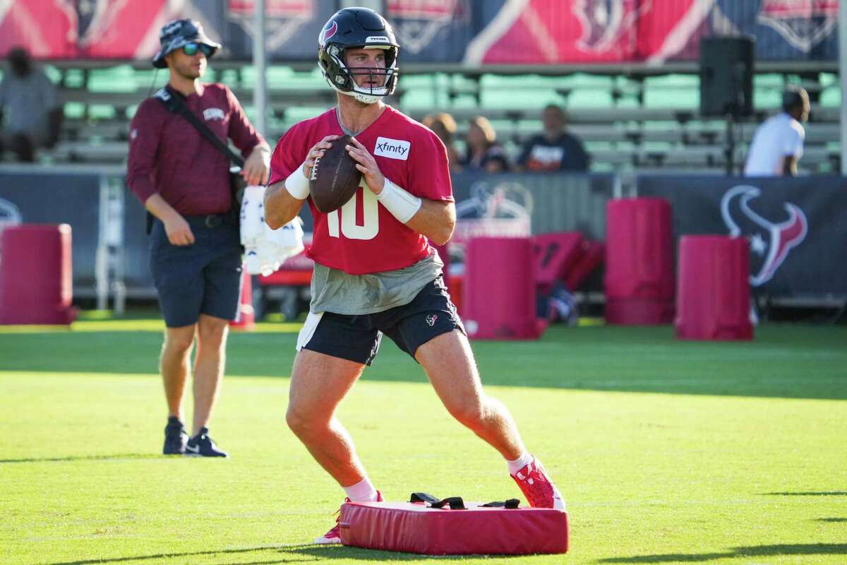 Houston Texans quarterback Davis Mills drops back to pass during an NFL training camp Friday, July 29, 2022, in Houston.