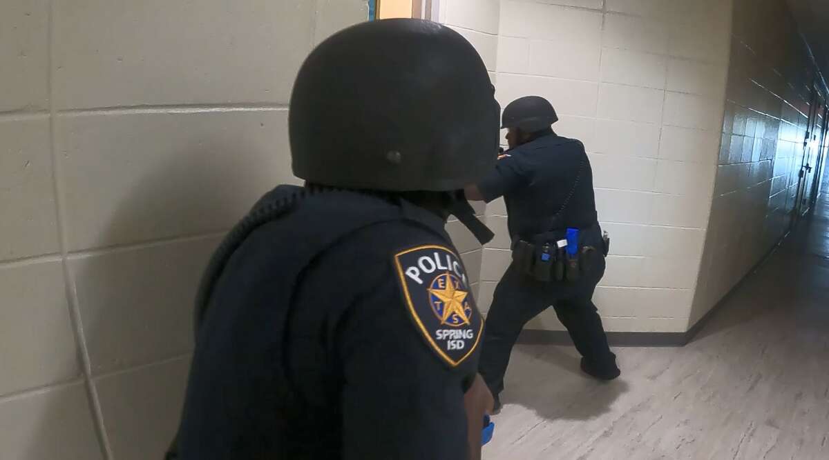 In this screenshot of a video provided by Spring ISD, district police officers take part in an active shooter drill and training exercise Thursday, July 28, 2022. 
