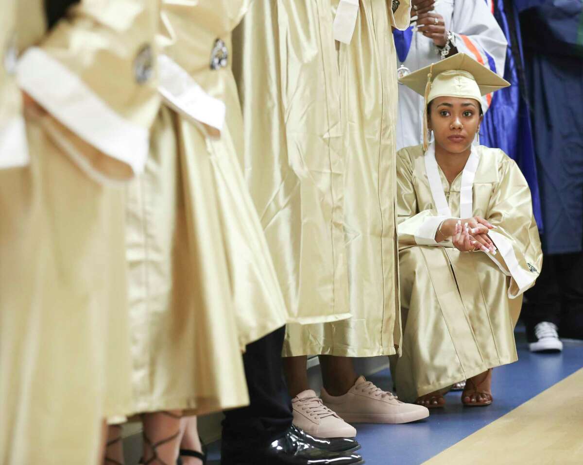 Conroe High School senior Shania Yates waits for the start of a summer graduation ceremony for Conroe ISD students at College Park High School, Thursday, July 28, 2022, in The Woodlands. Nearly 50 senior student from across Conroe ISD received their high school diplomas.