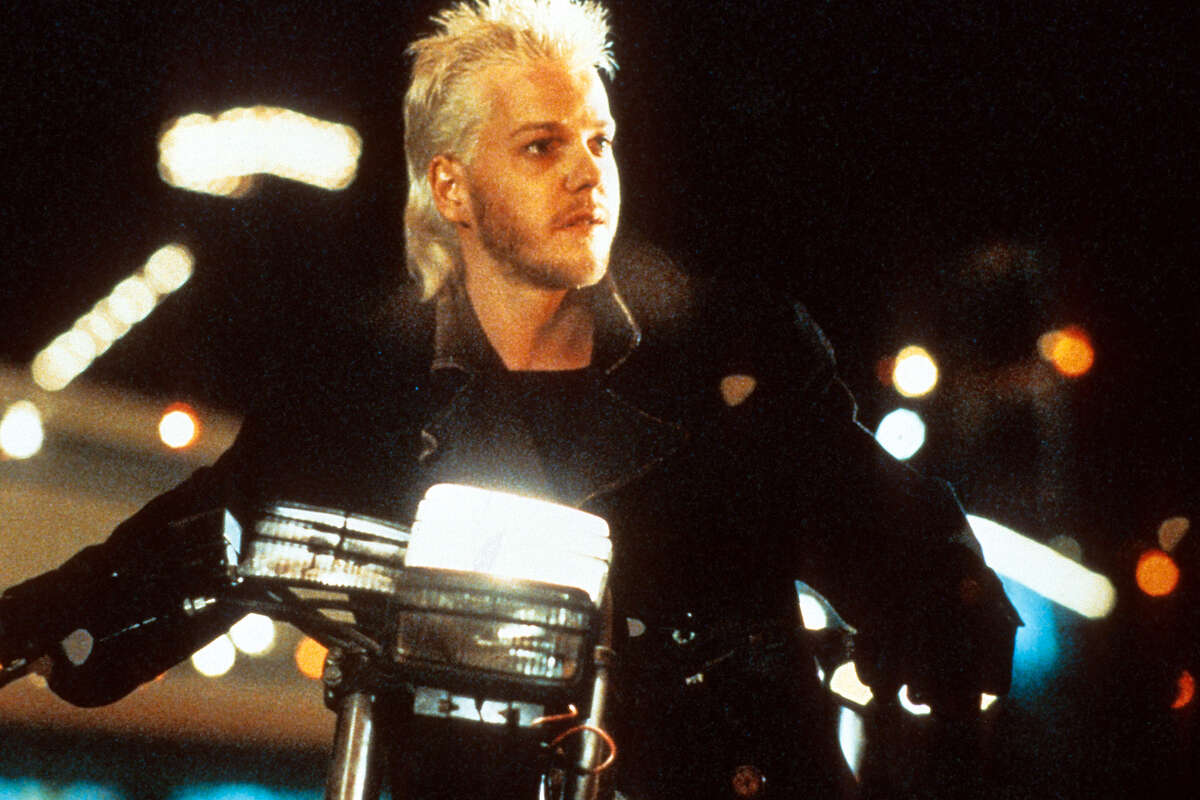 Kiefer Sutherland on a motorcycle in a scene from the film "lost boys," which opened on July 31, 1987.