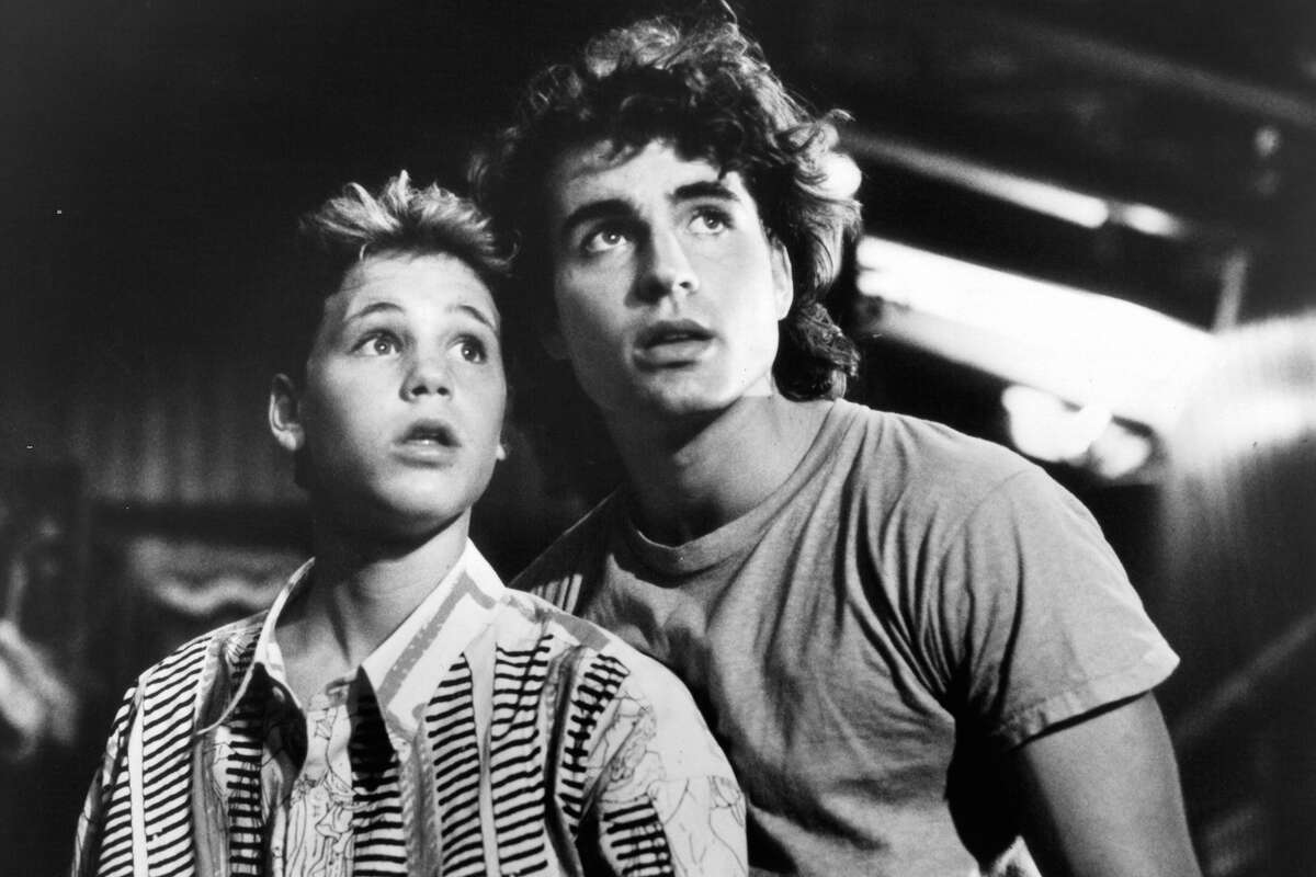 Corey Haim and Jason Patric in a scene from the film "The Lost Boys," 1987. The film turns 35 on July 31, 2022. 