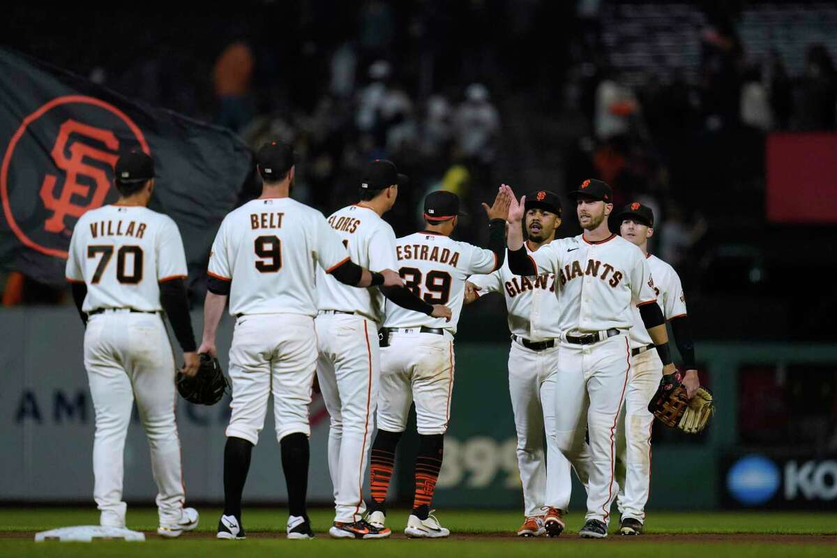 San Francisco Giants celebrate a 4-2 win against the Chicago Cubs in a baseball game in San Francisco, Thursday, July 28, 2022. (AP Photo/Godofredo A. Vásquez)