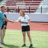 Greenwich Board of Education member and president of Rugby Connecticut Joe Kelly, left, awards Erin Martschanko, Greenwich High’s girls rugby coach, the 2022 Girls Rugby Coach of the Year plaque at Cardinal Stadium on Tuesday, July 26, 2022.
