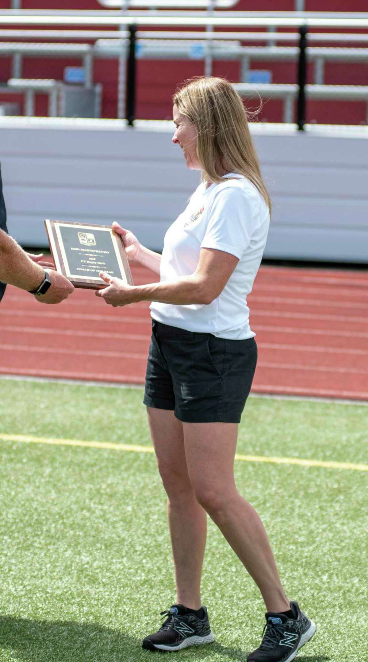 Greenwich girls’ rugby coach Erin Martschanko accepts the 2022 Girls Rugby Coach of the Year plaque at Cardinal Stadium on Tuesday, July 26, 2022.