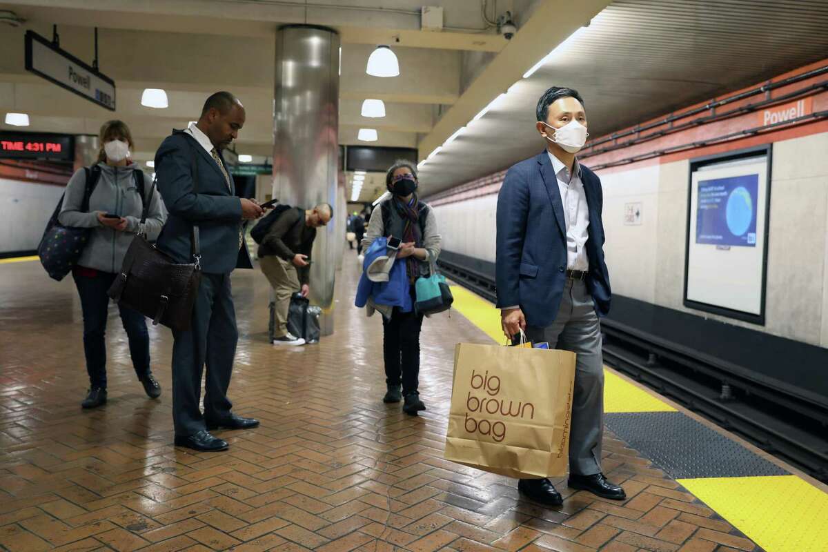 BART has reinstated a mask mandate on trains for riders and employees, effective immediately. The photo shows riders at Powell Street Station in April.