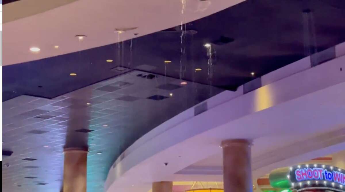 Water falls through holes in the ceiling at Caesar's Palace in Las Vegas amid thunderstorms on July 28, 2022.