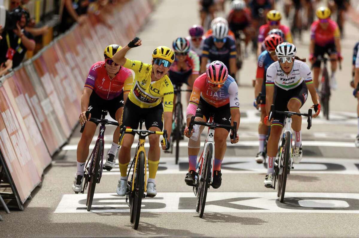Netherland's Marianne Vos, wearing the overall leader's yellow jersey, celebrates as she crosses the finish in Rosheim, eastern France, Friday, July 29, 2022, during the 6th stage of the Tour de France women's cycling race over 128,6 kilometres (80.4 miles) with start Saint-Die-des-Vosges and a finish in Rosheim. (AP Photo/Jean-Francois Badias)