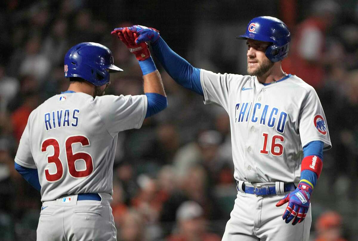 SAN FRANCISCO, CALIFORNIA - JULY 29: Patrick Wisdom #16 of the Chicago Cubs is congratulated by Alfonso Rivas #36 after Wisdom hit a solo home run against the San Francisco Giants in the top of the fifth inning at Oracle Park on July 29, 2022 in San Francisco, California. (Photo by Thearon W. Henderson/Getty Images)