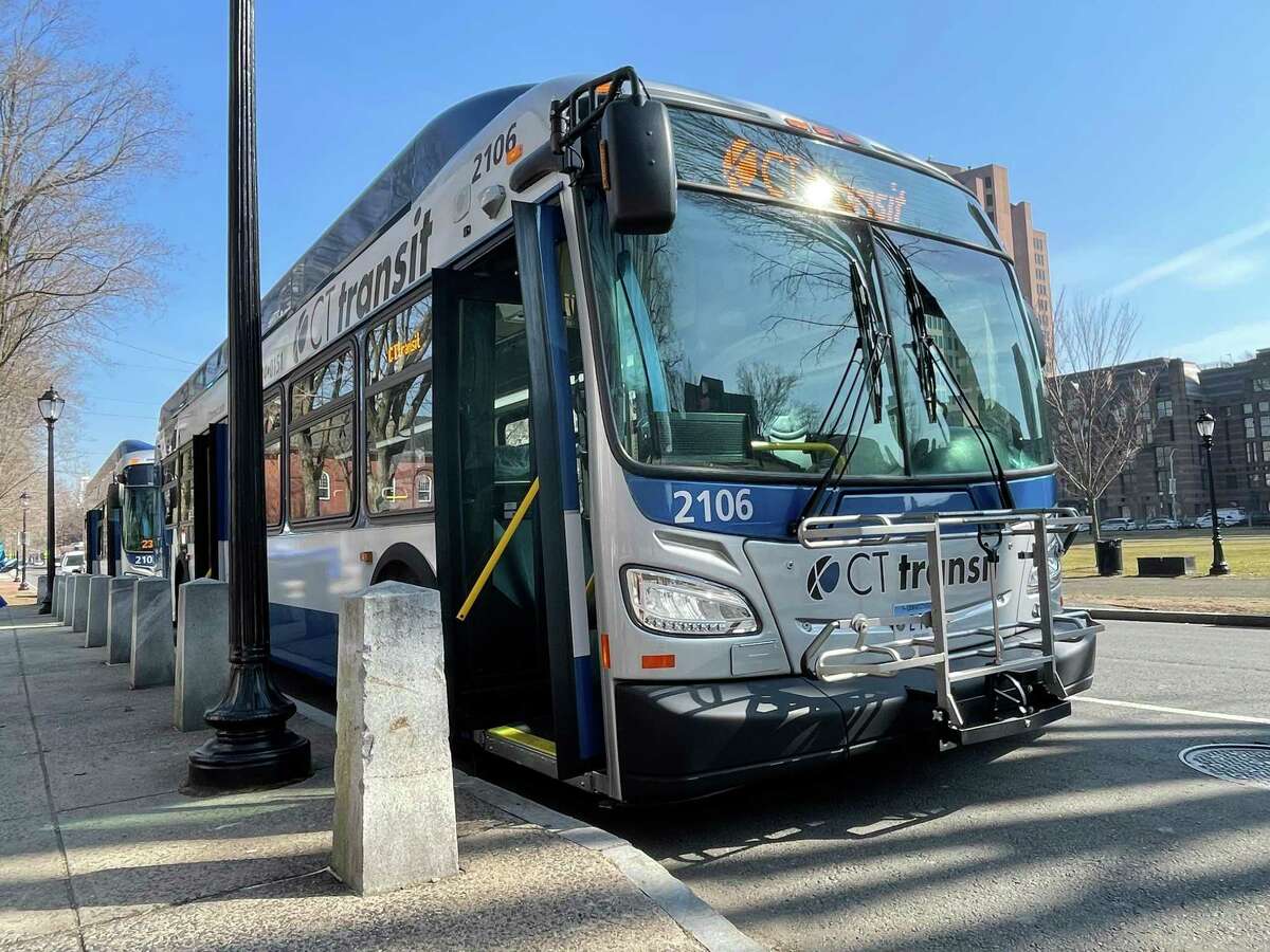 Two electric CTtransit buses parked in front of the New Haven green on March 11, 2022.