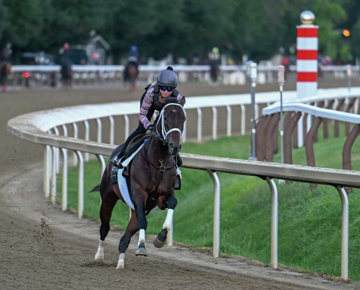 Life is Good, with exercise rider Amelia Green, moves over the main track in his final speed work before Saturday's Whitney Stakes at Saratoga Race Course.