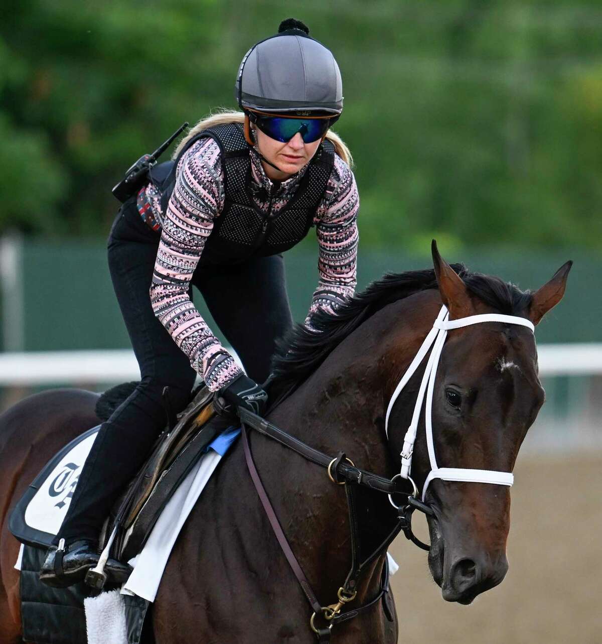 Life is Good, with exercise rider Amelia Green, gallops back to the barn after his final speed work before Saturday's Whitney Stakes at Saratoga Race Course.