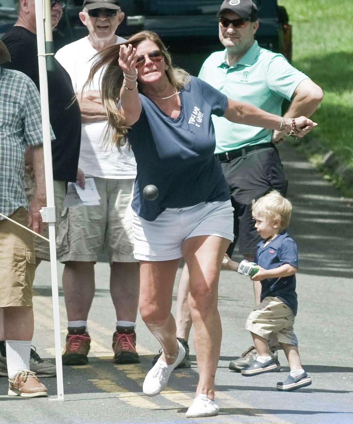 Cathy Loudon, of Sandy Hook, delivers the ball during a game of Irish road bowling.
